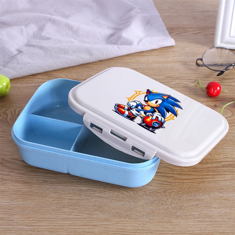 Food Storage Room - 漫画のソニックが描かれたランチボックス。フォークとスプーン付き。電子レンジ対応、持ち運び可能。学校やオフィスでの使用に最適。密閉式で食品を安全に保存できる。